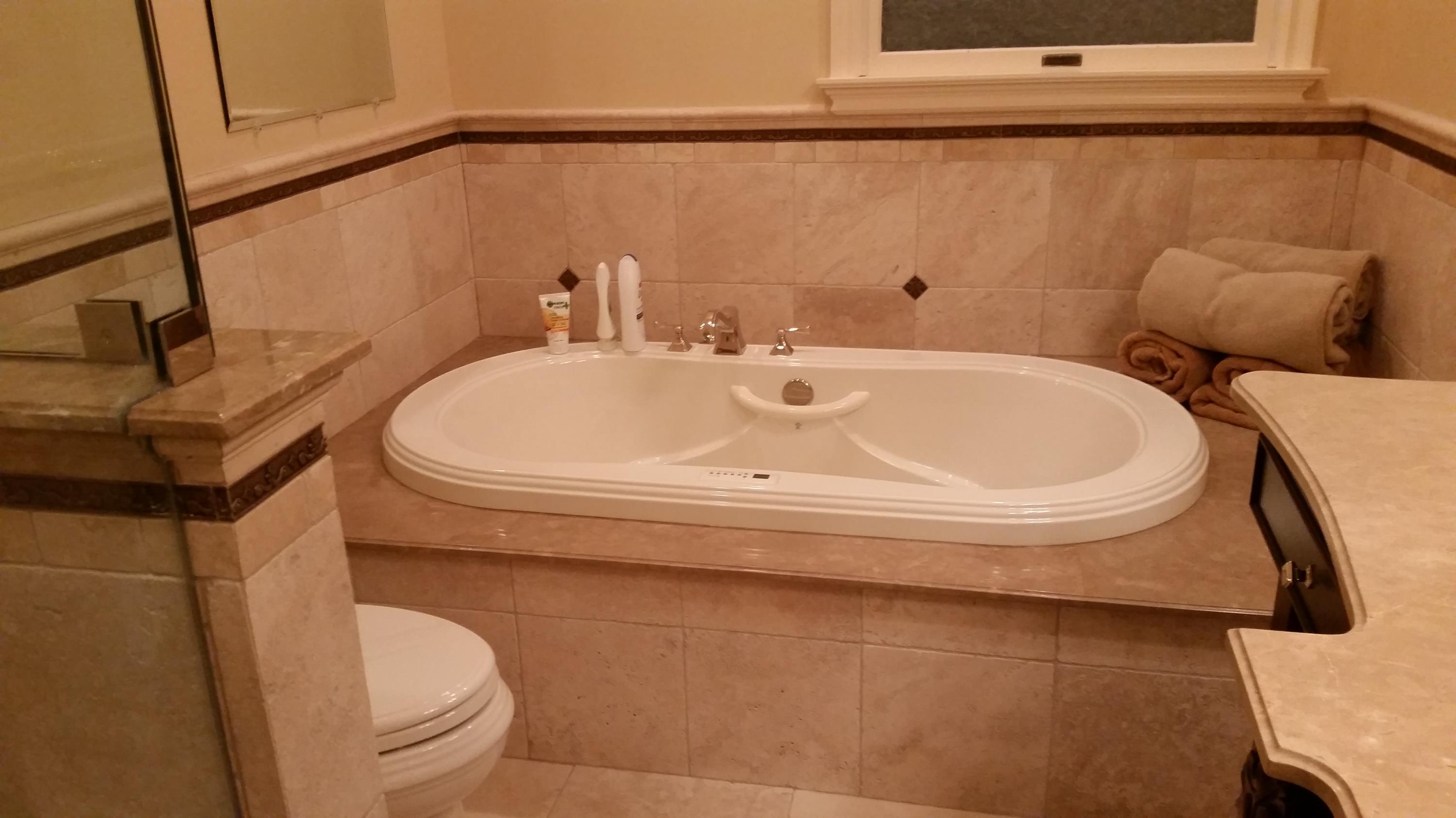 Finished bathroom remodeling project with tub