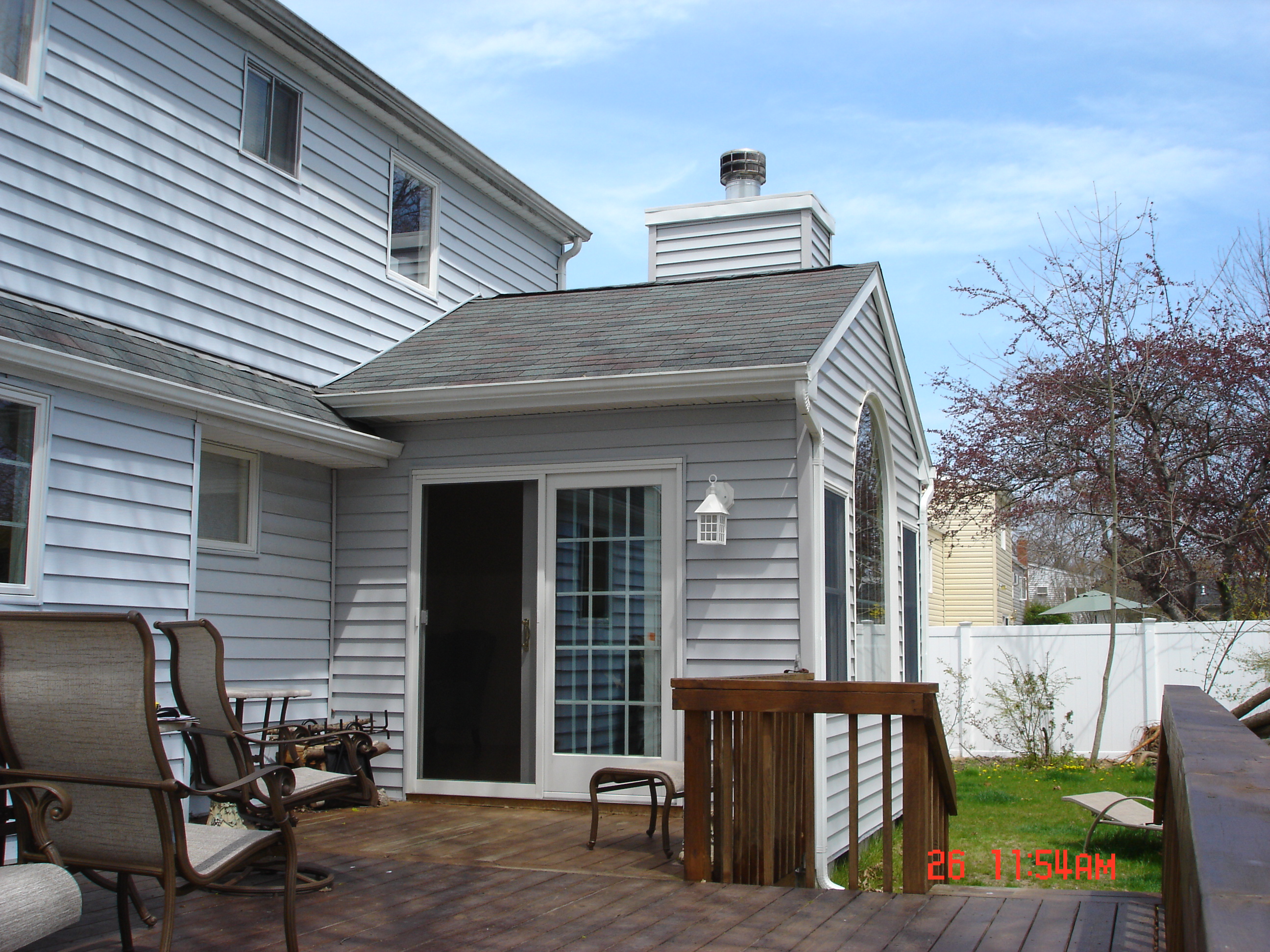 Home addition with white siding